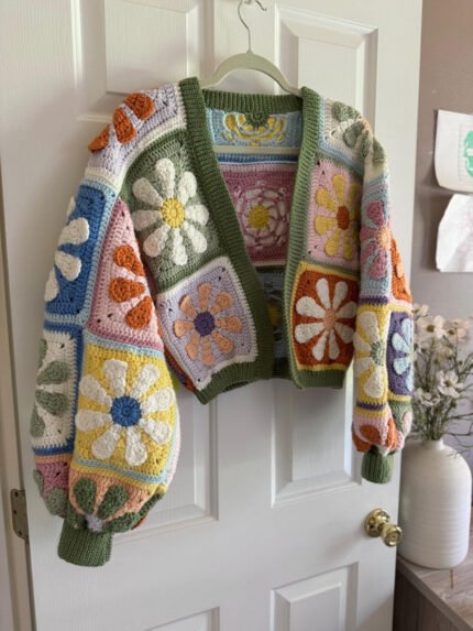 Colorful crochet cardigan with retro daisy granny square pattern