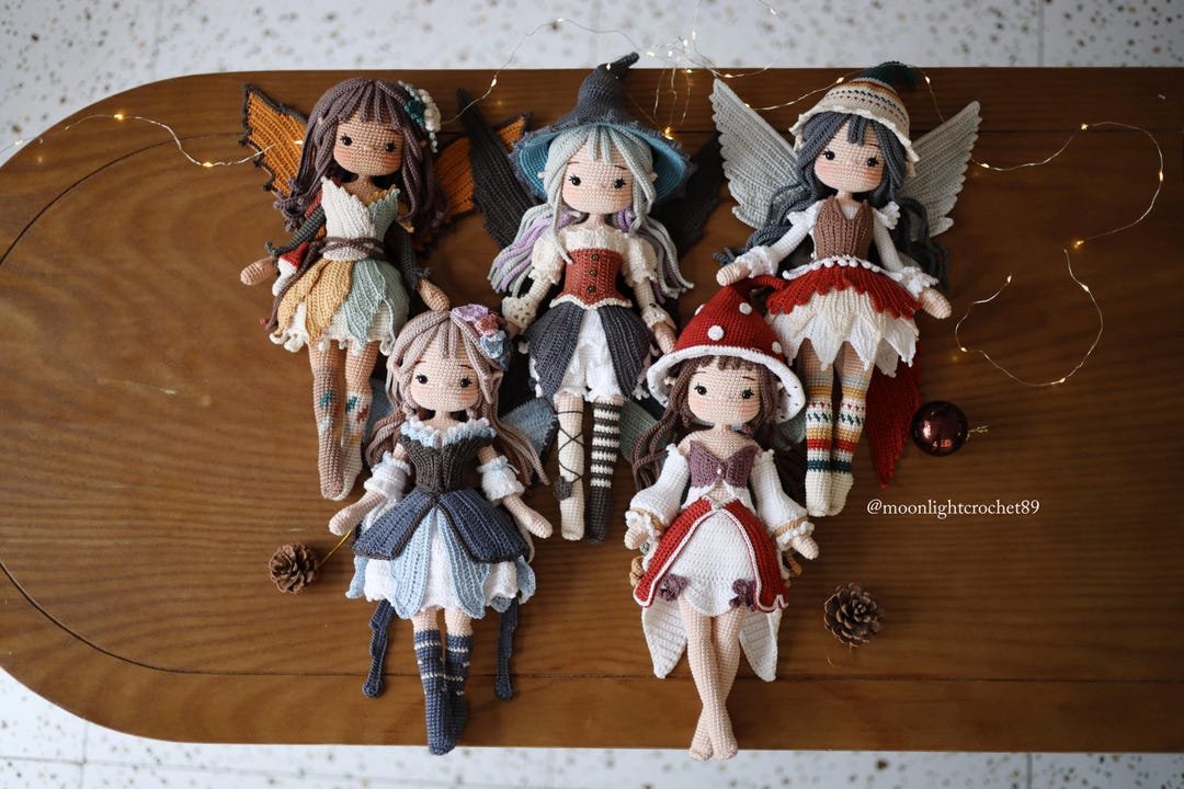 Five handmade crochet fairy dolls with detailed outfits and wings