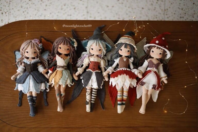 Five crochet fairy dolls in different colored dresses